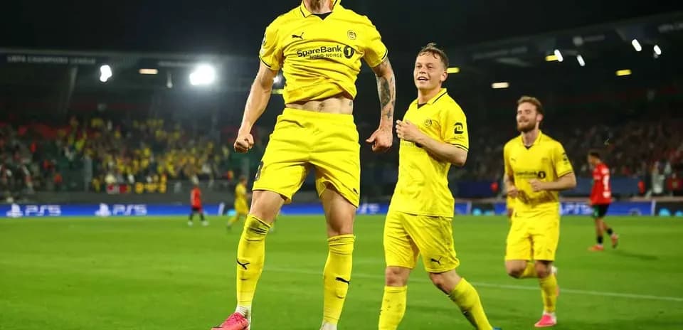 Players celebrating goal during UEFA Champions League match