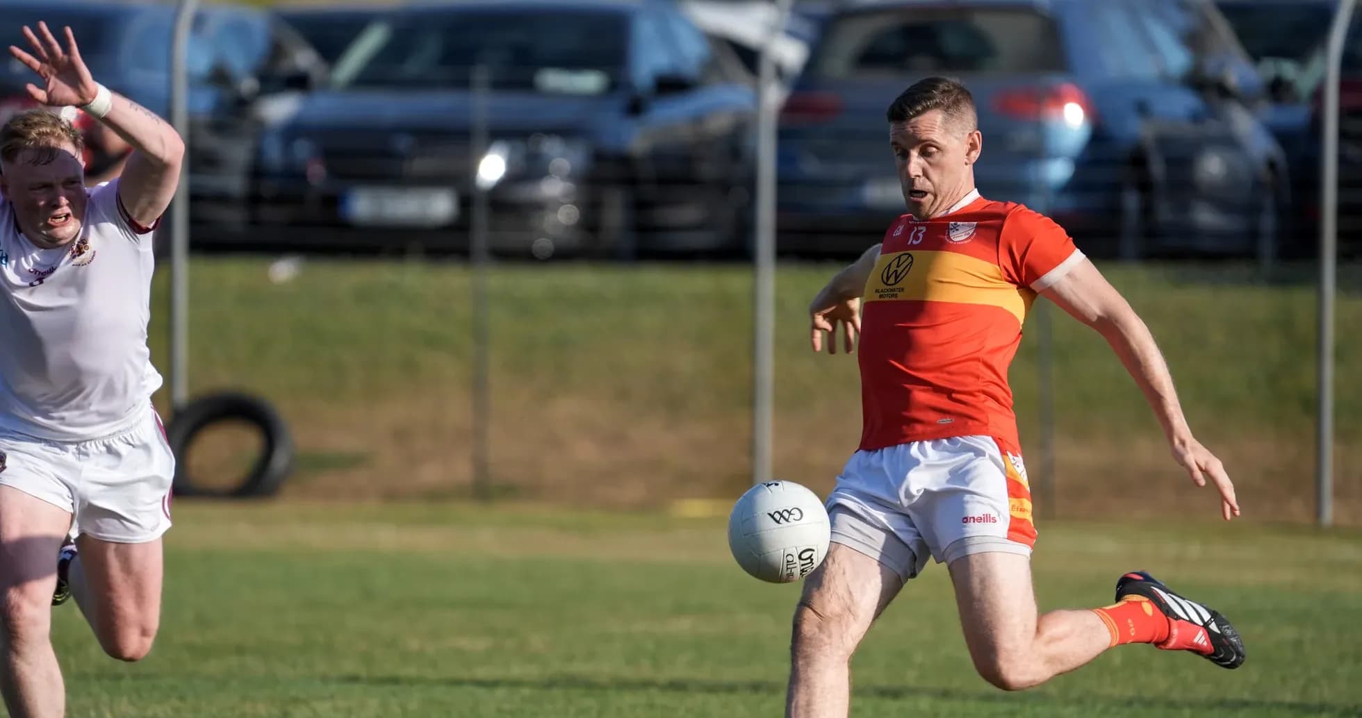 Player kicking a football during a match