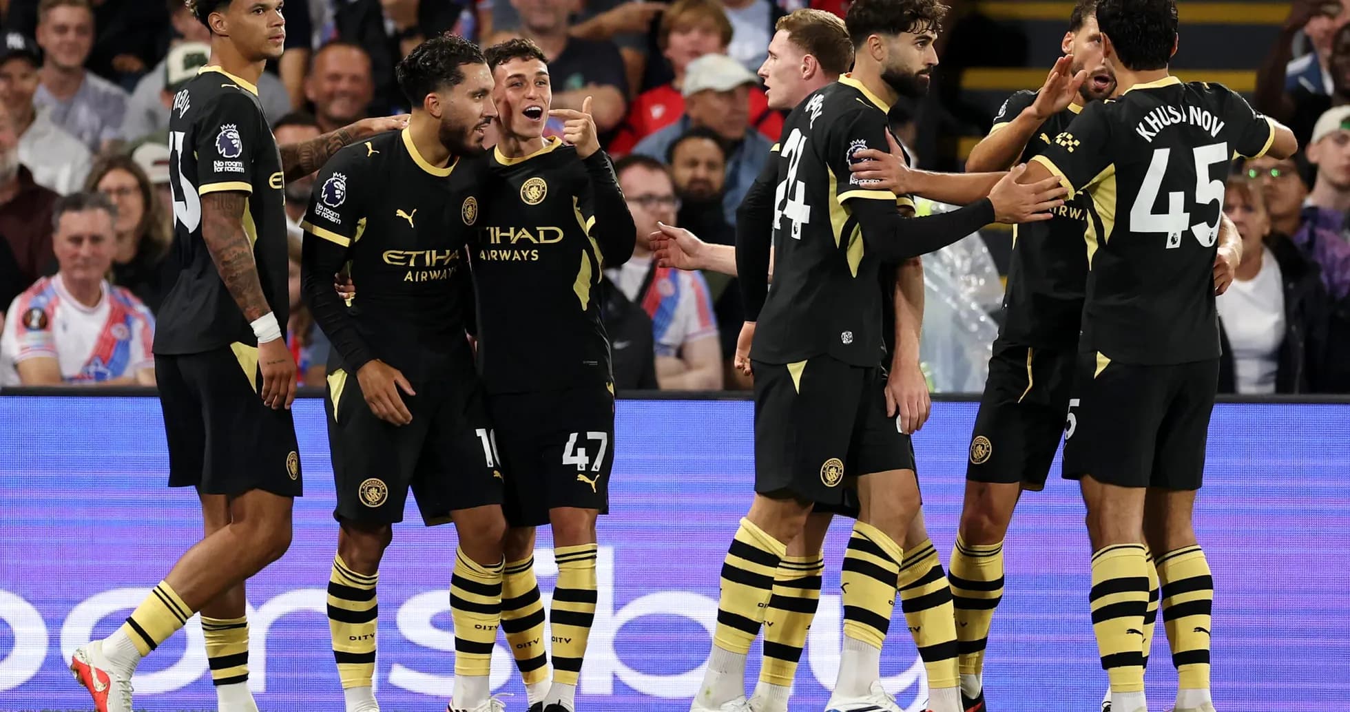 Manchester City players celebrating a goal