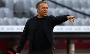 Coach gesturing during a match from the sidelines