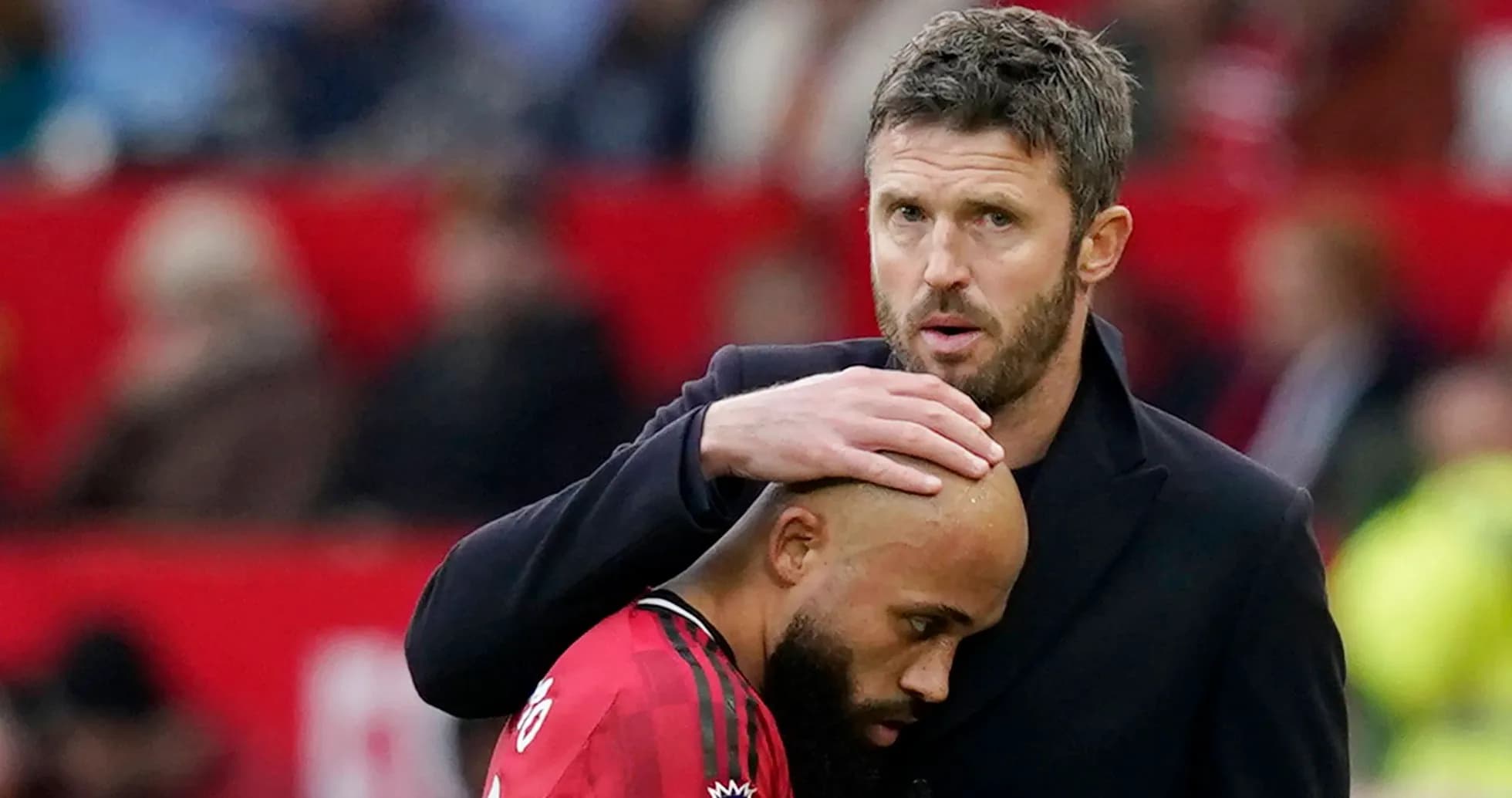 Coach comforting player during match on sideline