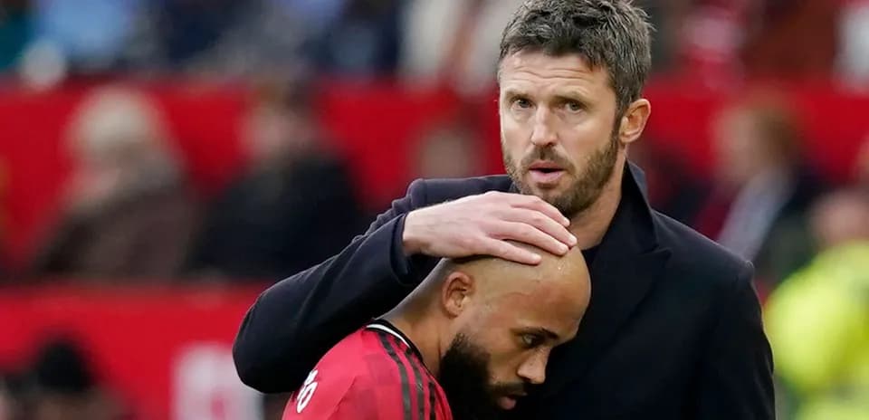 Coach comforting player during match on sideline