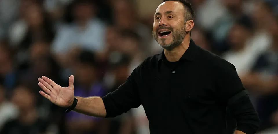 Coach gesturing during a match from the sideline