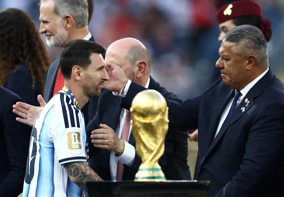 Lionel Messi receiving trophy during award ceremony