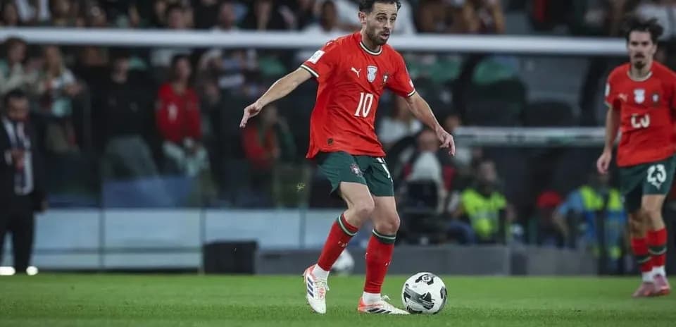 Player in red jersey controlling the ball during match