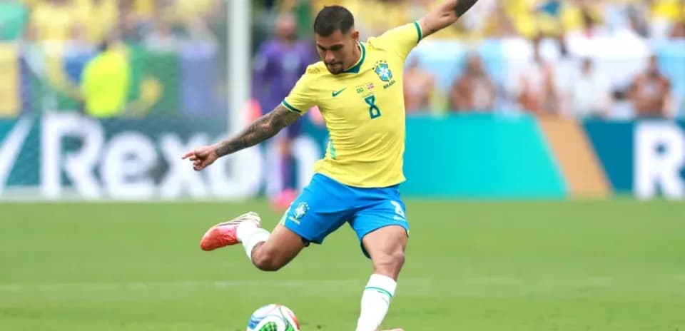 Brazilian player kicking the ball during match