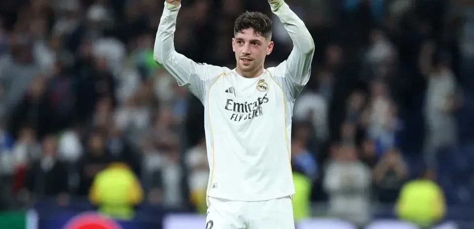 Player celebrating with raised arms after match