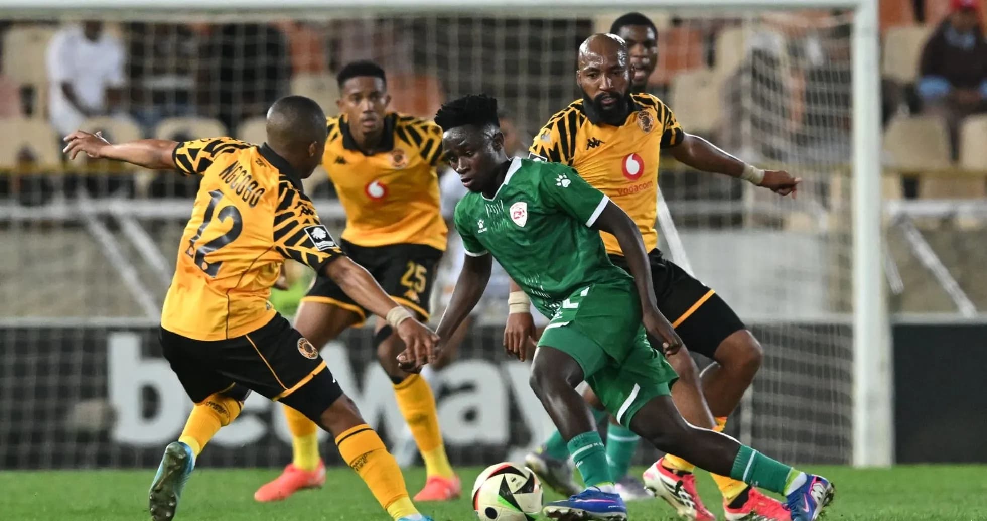 Players contesting the ball during a football match