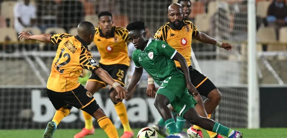 Players contesting the ball during a football match