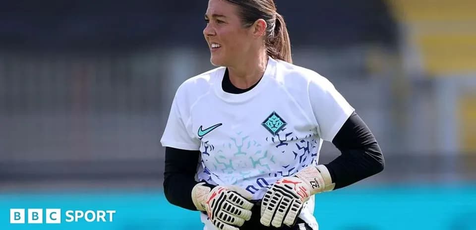 Goalkeeper training in white jersey with gloves