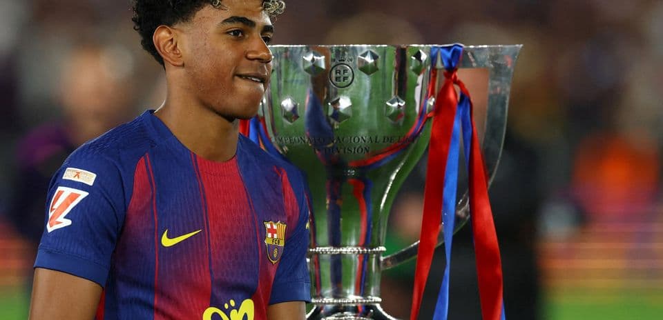 Player celebrating with trophy after match