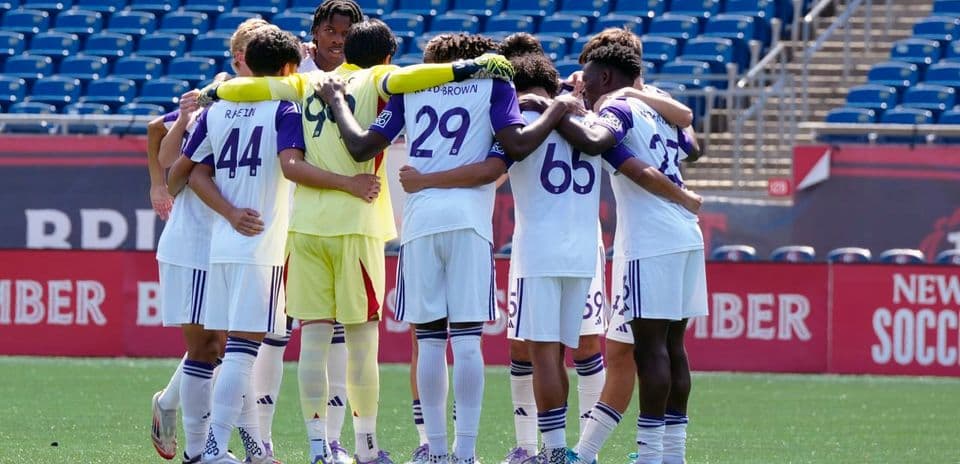 Orlando City II players in team huddle