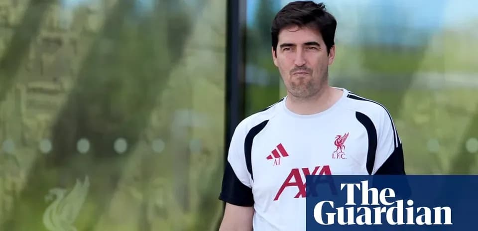 Coach walking outside Liverpool training facility