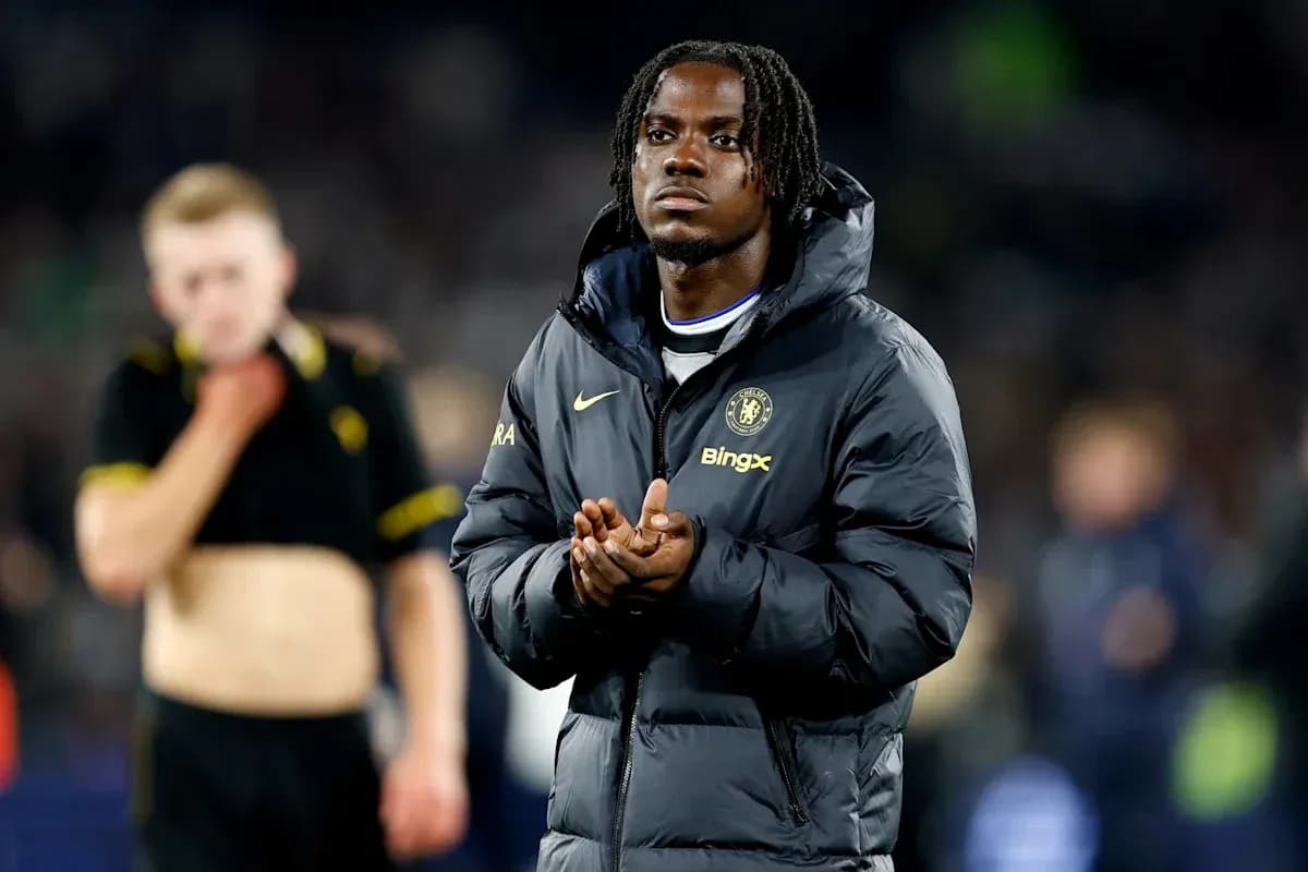 Player in Chelsea jacket clapping after match