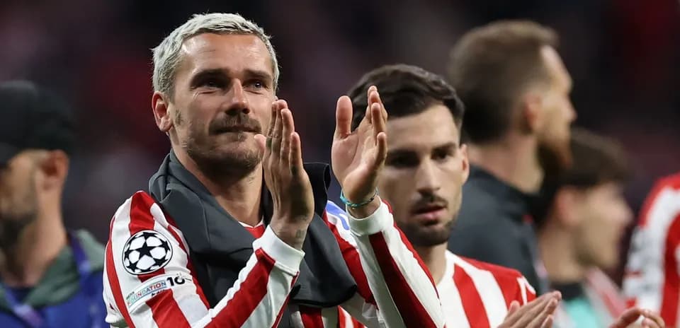 Player applauding fans after a match