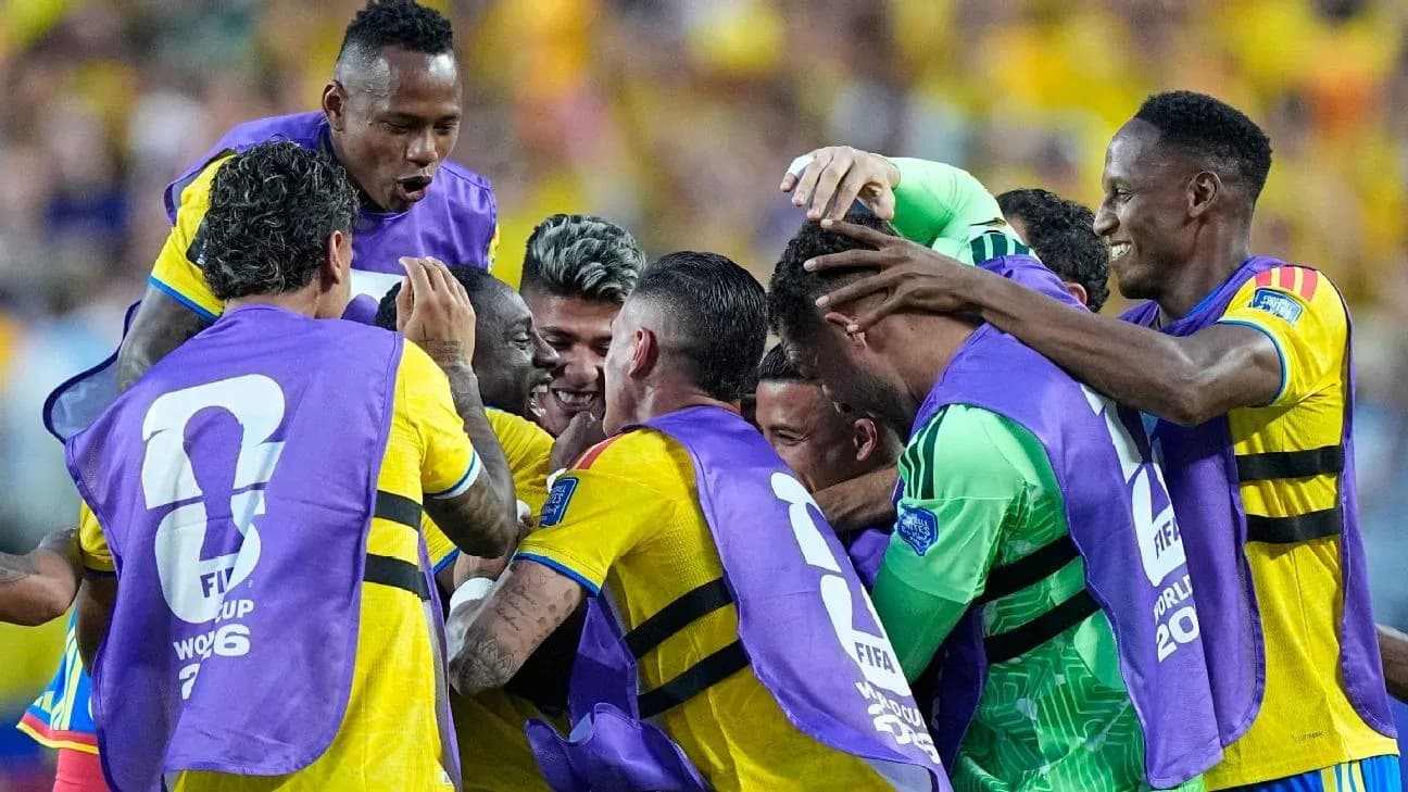 Players celebrating a goal during a match