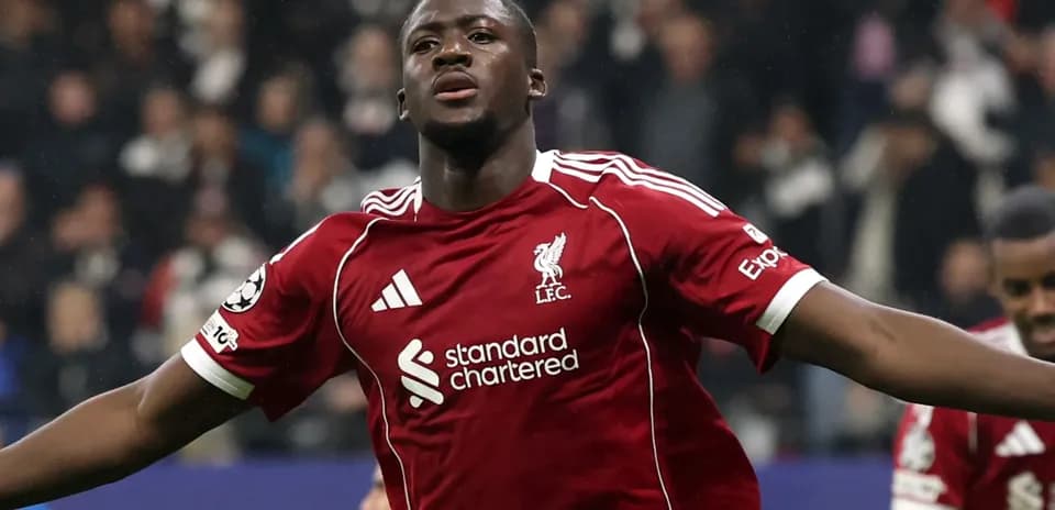 Player celebrating a goal in Liverpool jersey