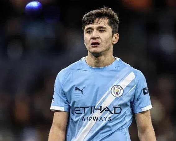 Player wearing Manchester City kit on the pitch