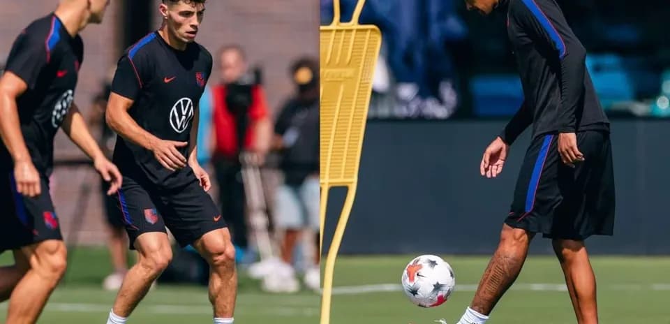 Two players training on the pitch with a ball