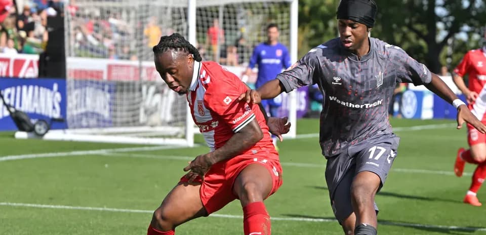 Players battling for possession during Vancouver FC match