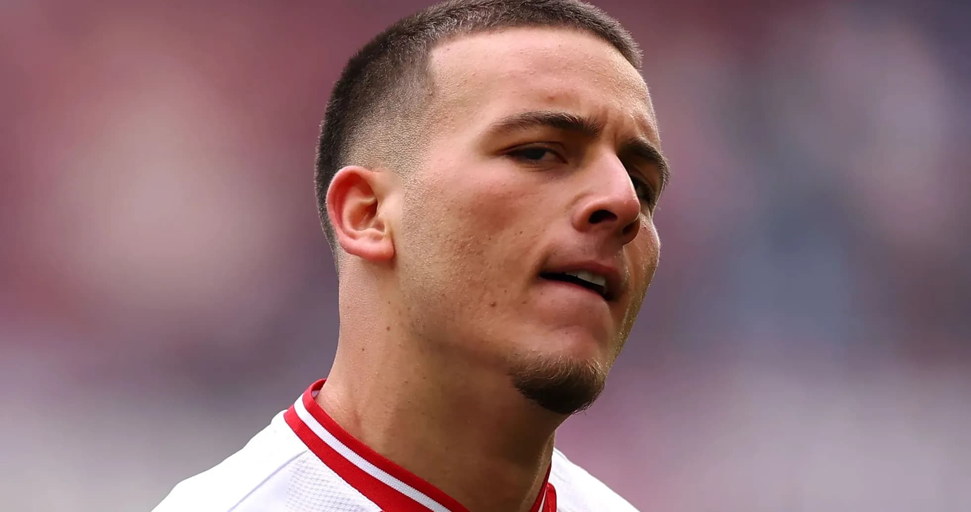 Player with short hair in team jersey