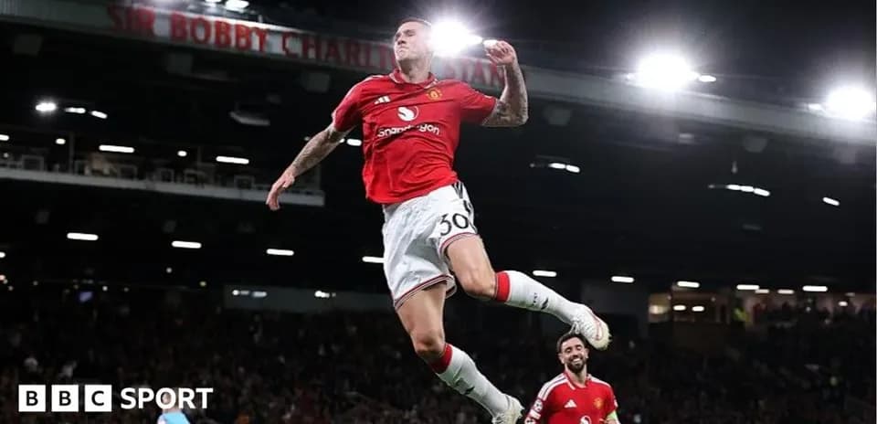 Player celebrating a goal at Old Trafford stadium