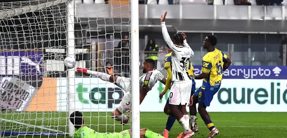 Goalkeeper attempts to save shot during Juventus match