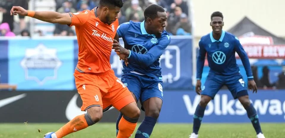 Players competing for the ball in match