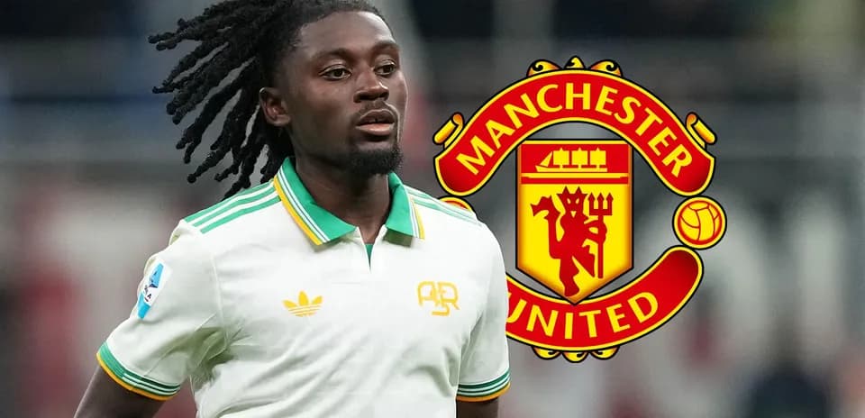 Player in white kit with Manchester United logo backdrop