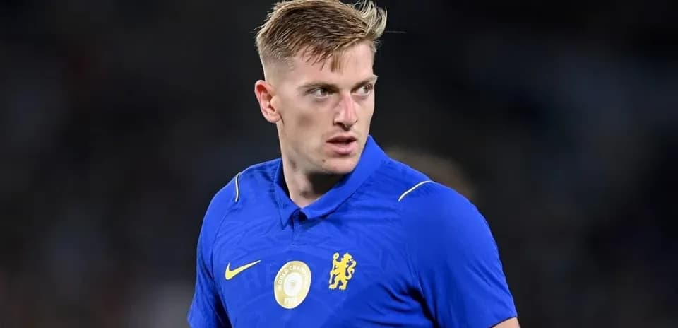 Player in blue Chelsea jersey during match warm-up