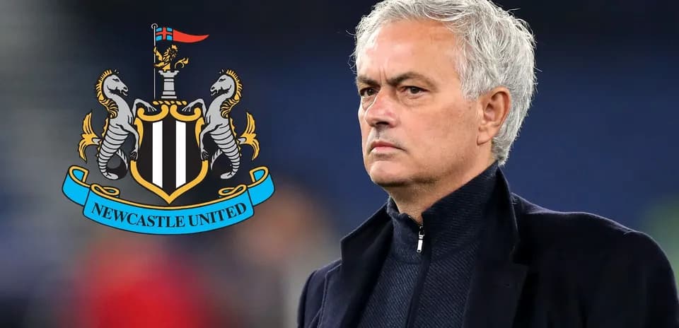 Manager standing beside Newcastle United logo