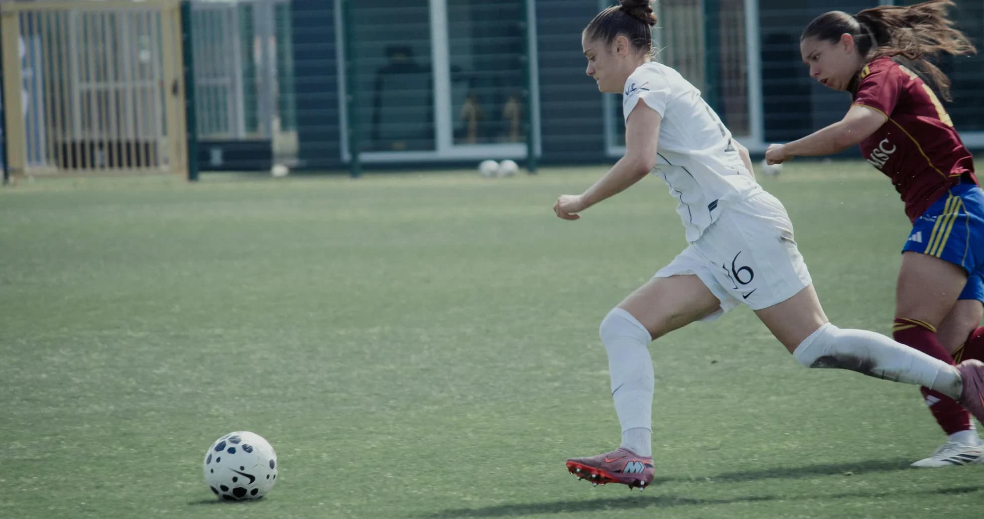 Player sprinting with ball during match