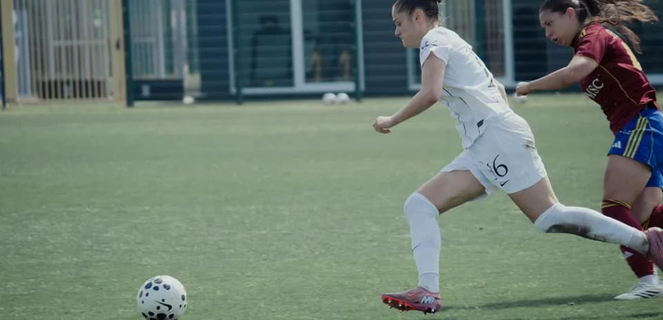 Player sprinting with ball during match