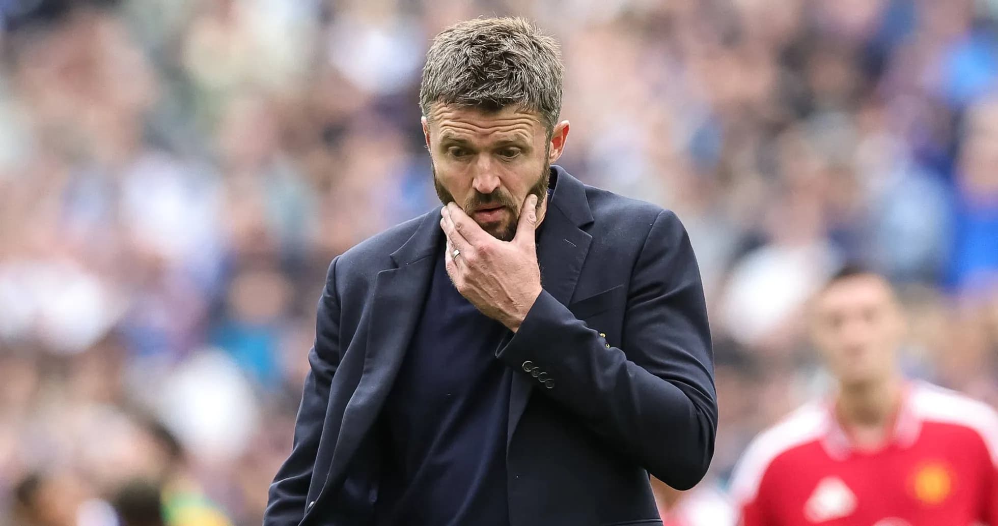 Coach looking thoughtful during a match