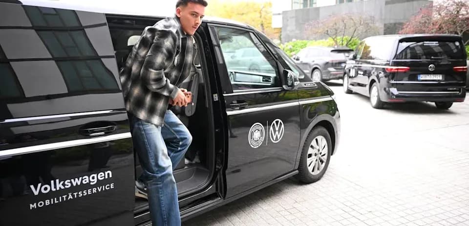 Player exiting Volkswagen vehicle at location