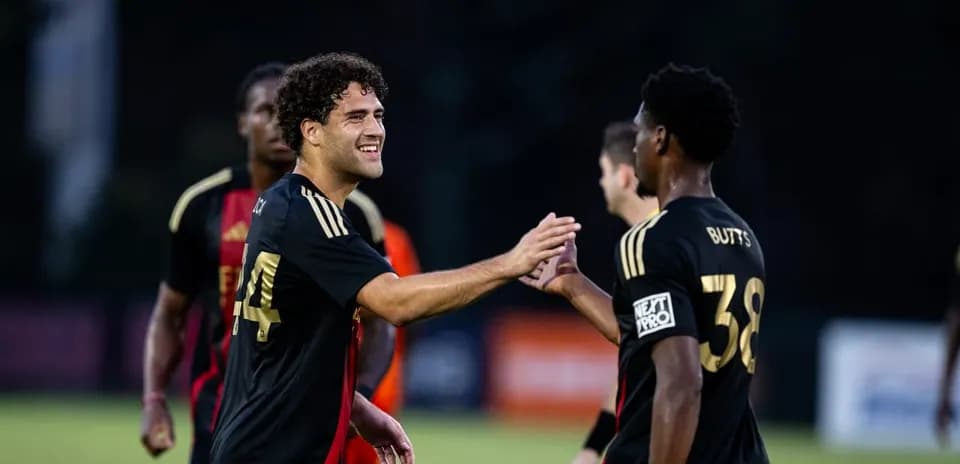 Players celebrating during MLS Next Pro match