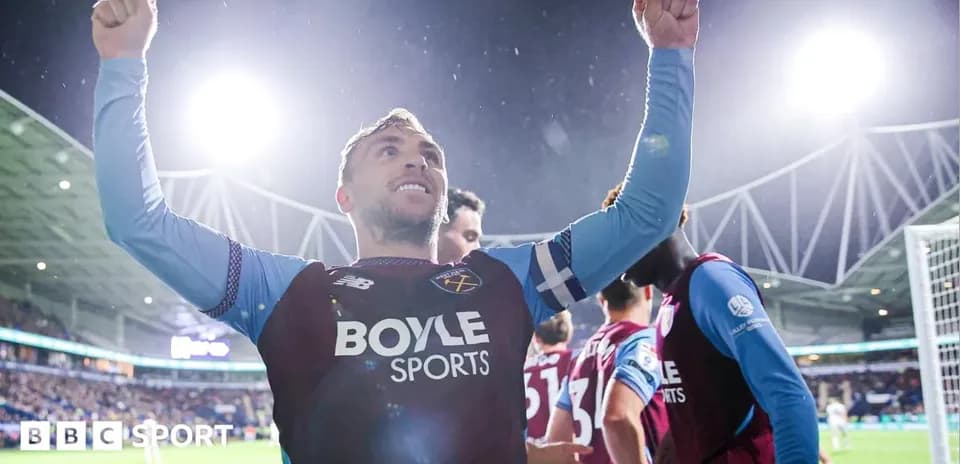 Player celebrating with raised arms after scoring