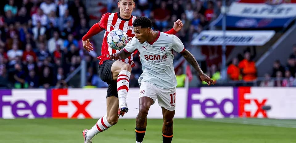 Two players contesting for the ball during match