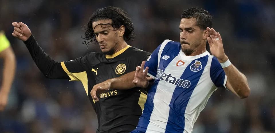 Two players battling for possession during match