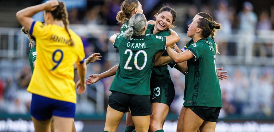 Players celebrating a goal during match