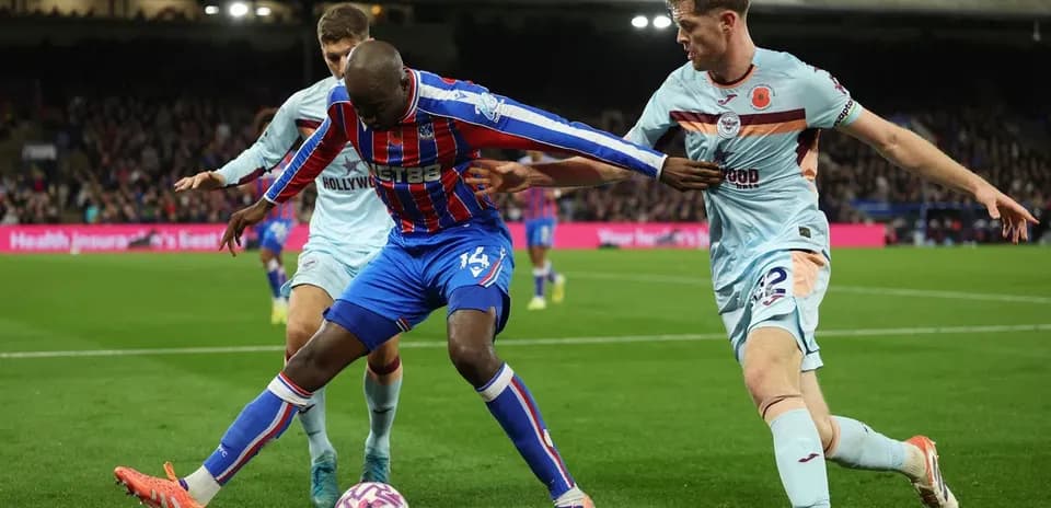 Players contesting for the ball during match