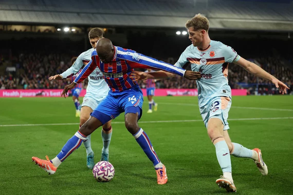 Players contesting for the ball during match