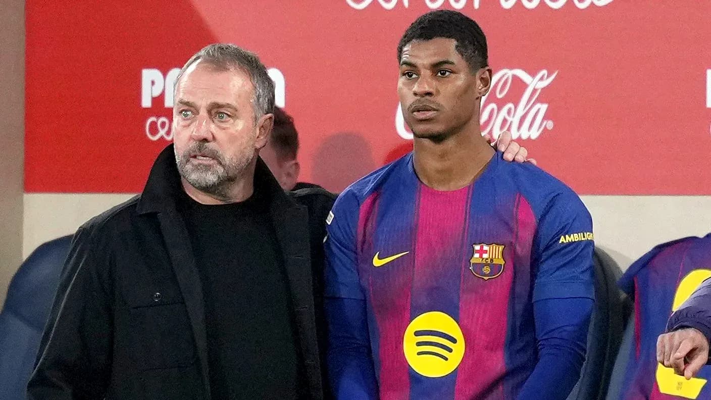 Coach and player discussing strategy on the sidelines