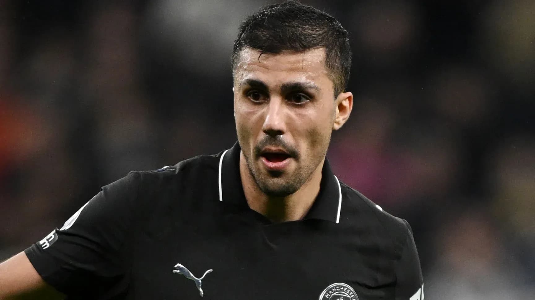 Player in black kit during a match