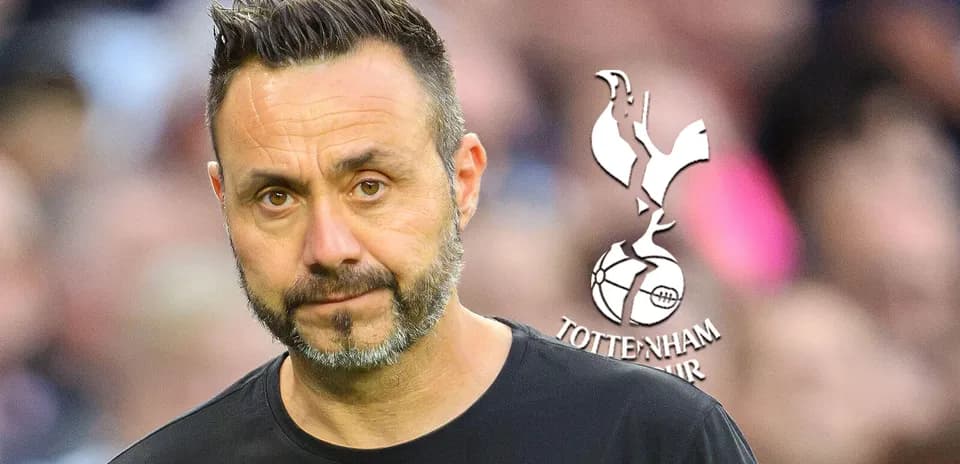 Manager with Tottenham Hotspur logo in background