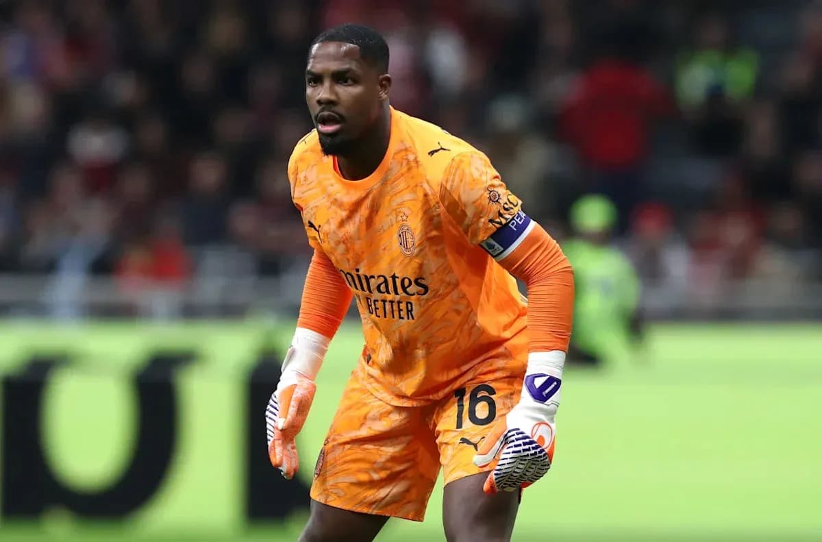Goalkeeper in orange kit preparing for play