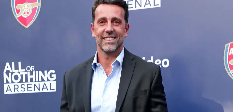 Person smiling at All or Nothing Arsenal event