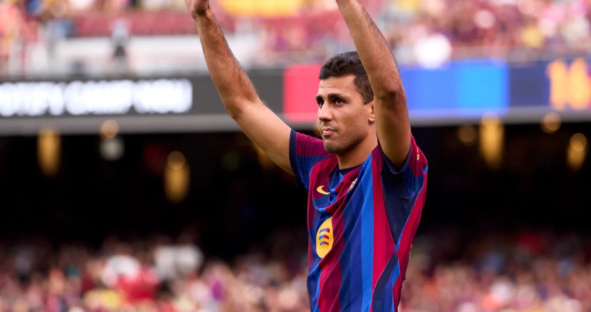 Player celebrating in front of cheering crowd