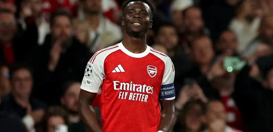 Arsenal player celebrating in front of crowd