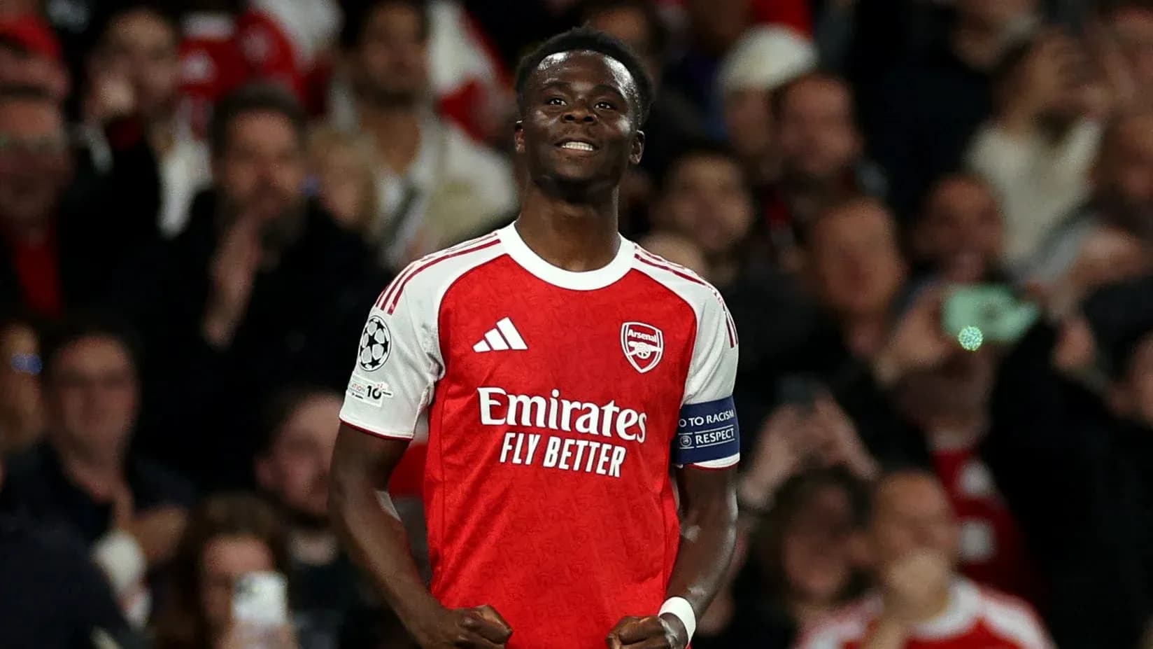 Arsenal player celebrating in front of crowd